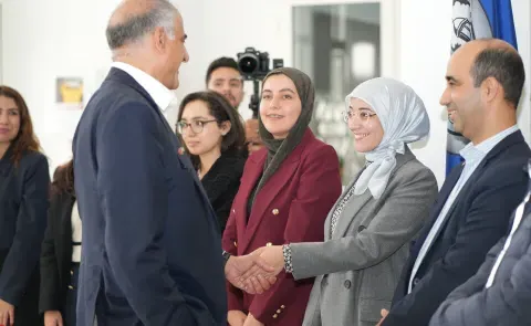 Ambassador Talwar greets a student